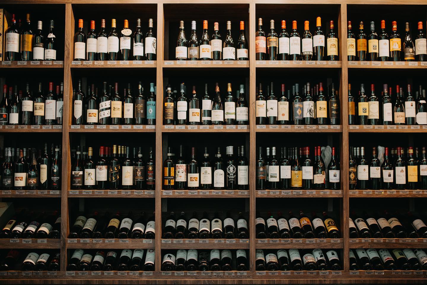 a shelf of wine bottles